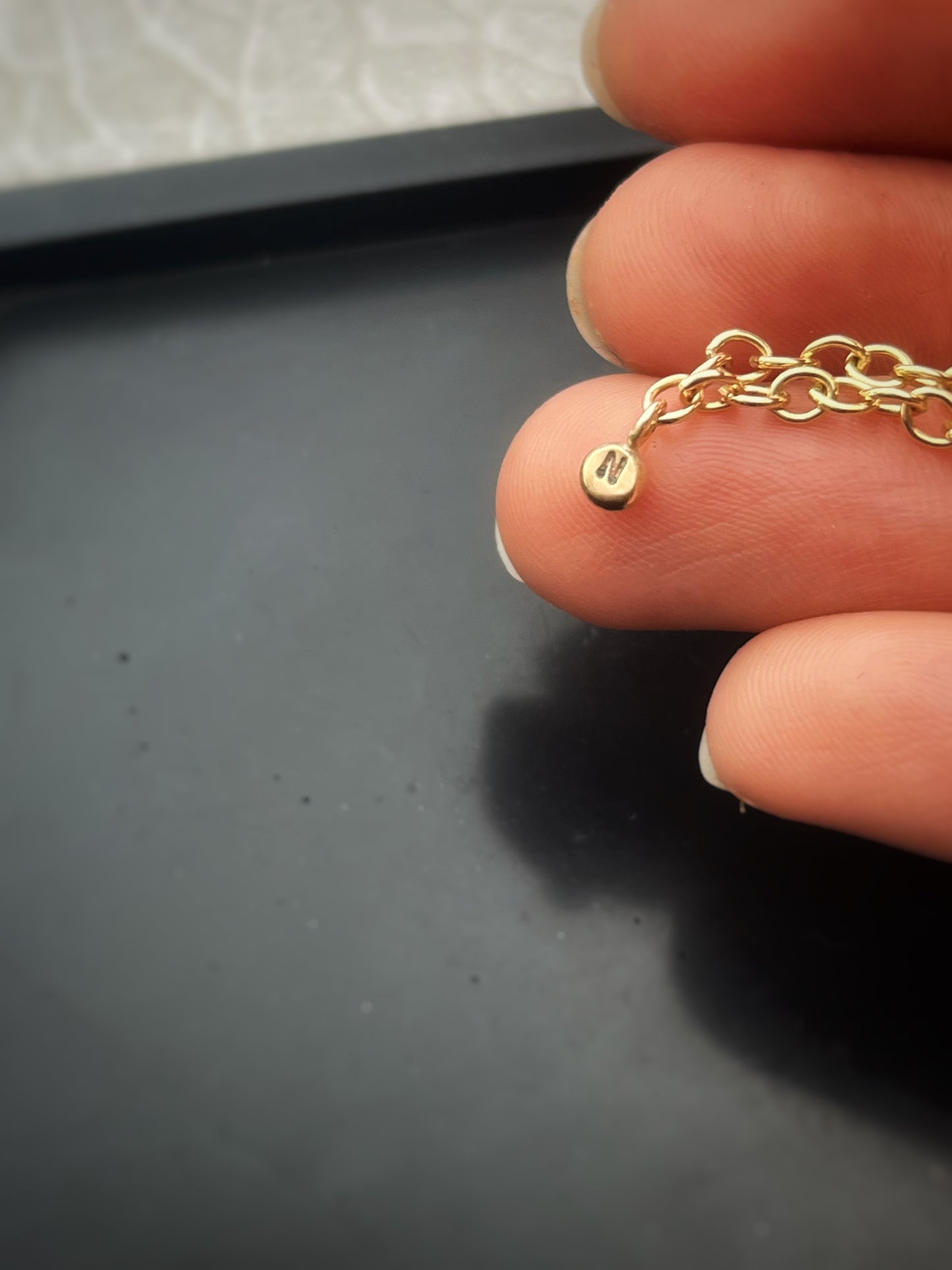 Solid 9ct gold personalised 5 letter pebble charm bracelet, recycled initial handmade chain bracelet