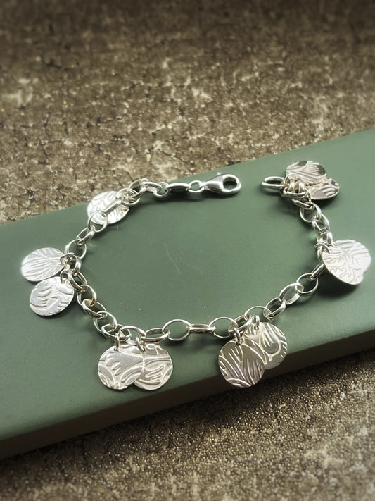 Floral embossed sterling silver charm bracelet