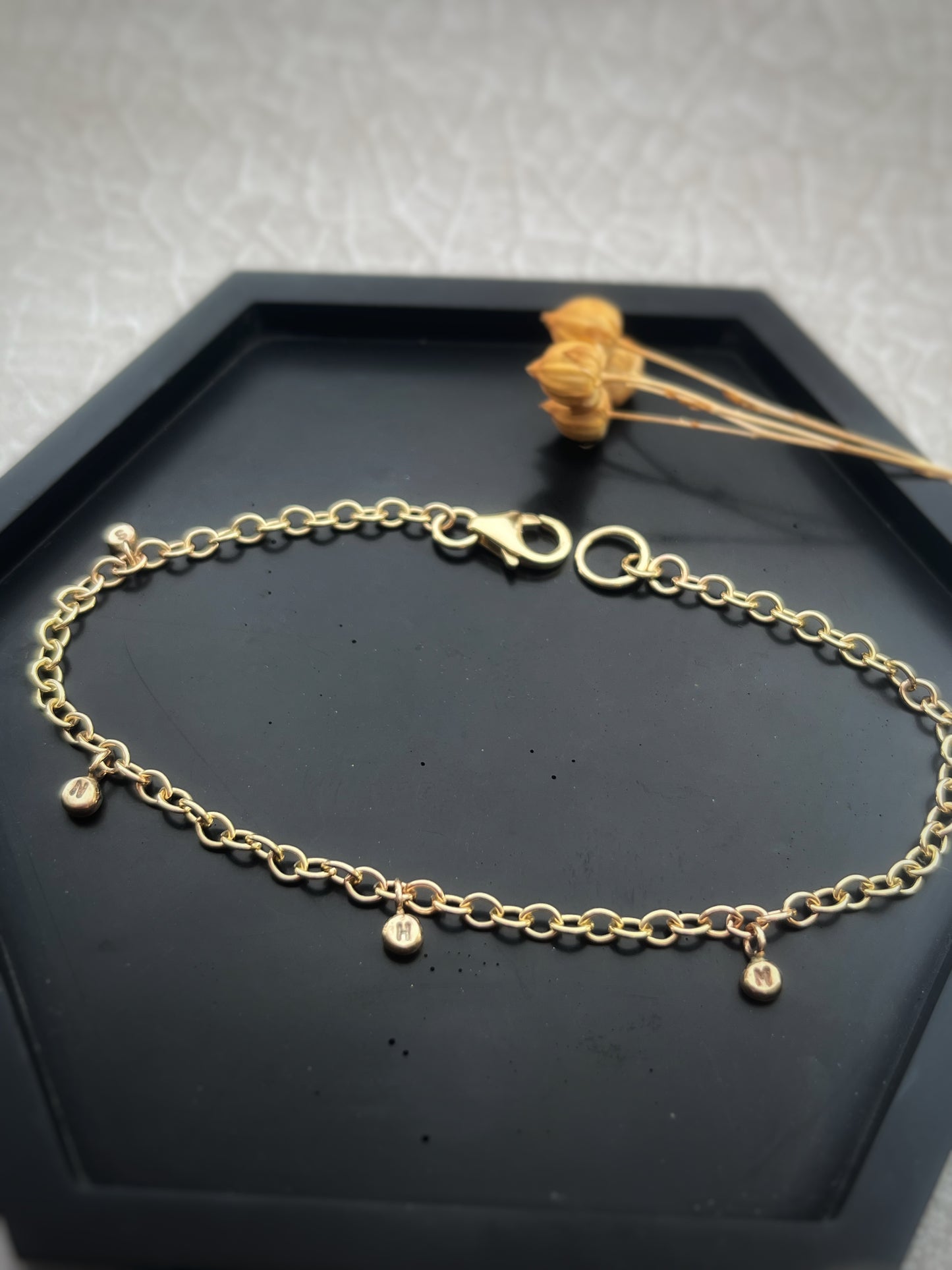 Solid 9ct gold personalised 5 letter pebble charm bracelet, recycled initial handmade chain bracelet