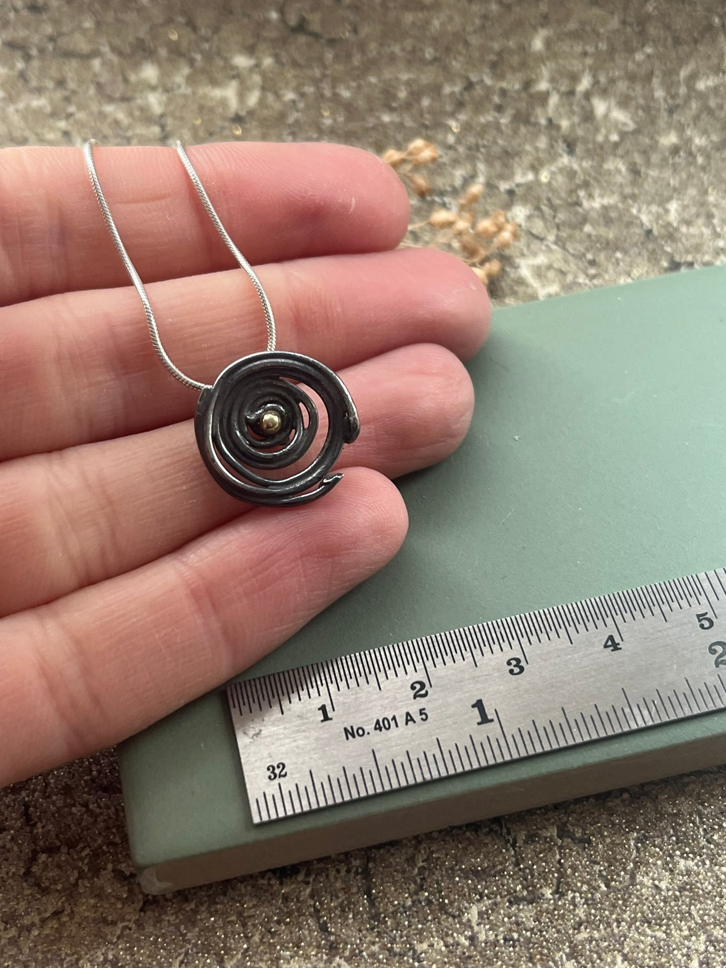 Oxidised blackened silver & 18ct gold swirl small pendant