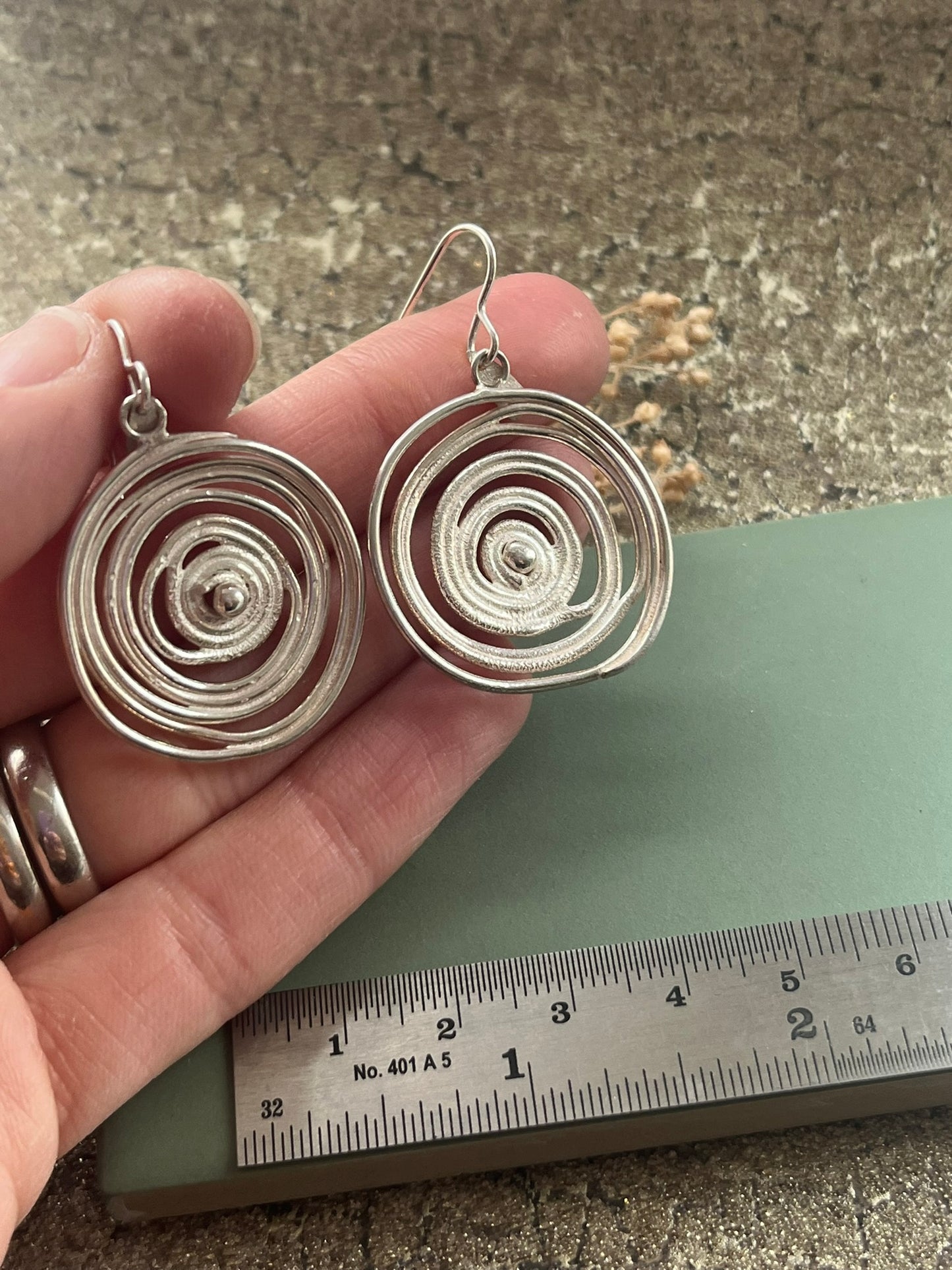 Sterling silver swirl statement earrings