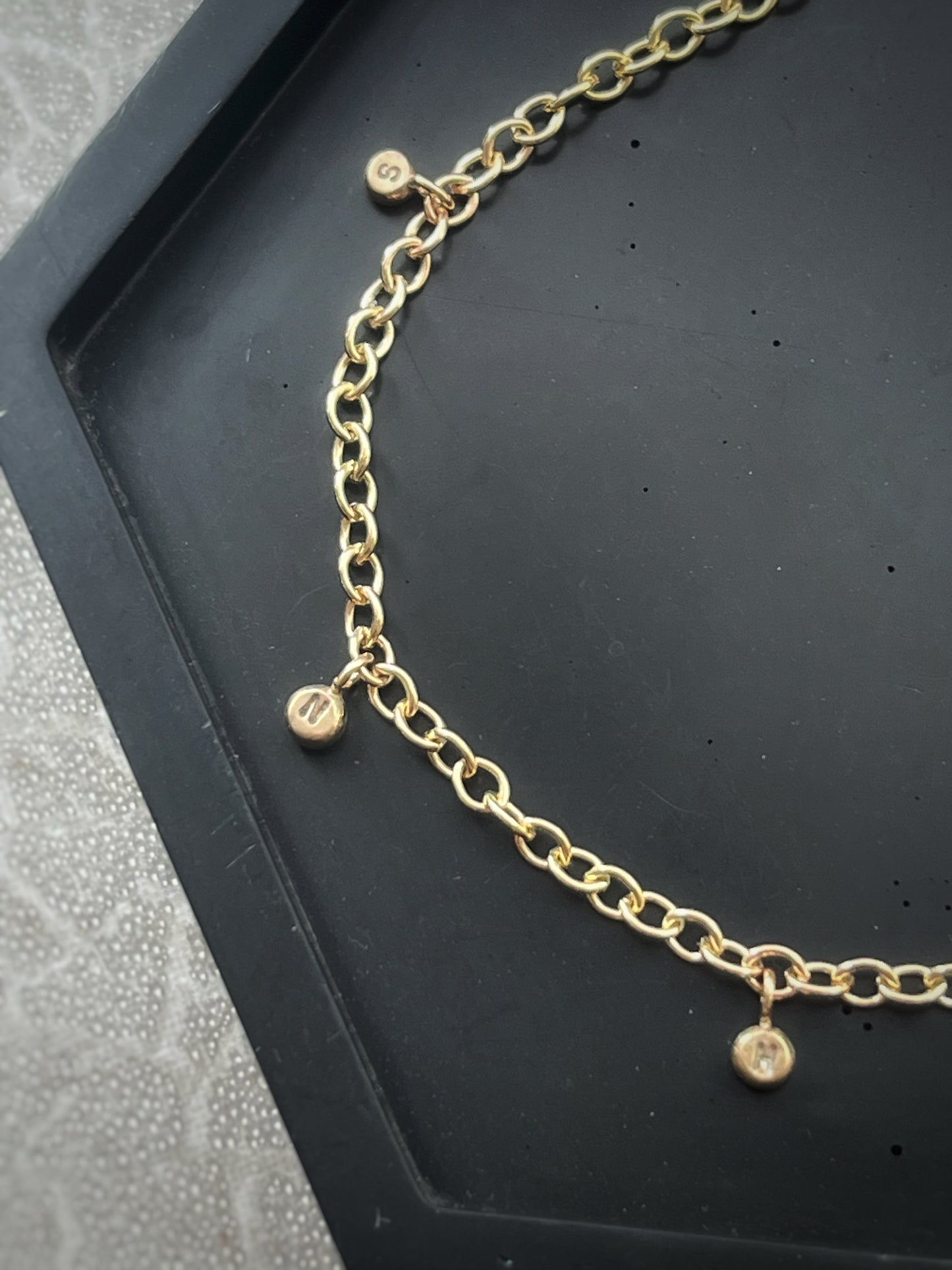 Solid 9ct gold personalised 5 letter pebble charm bracelet, recycled initial handmade chain bracelet