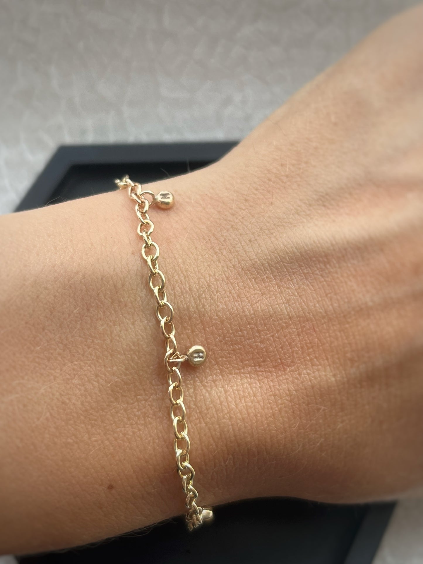 Solid 9ct gold personalised 5 letter pebble charm bracelet, recycled initial handmade chain bracelet