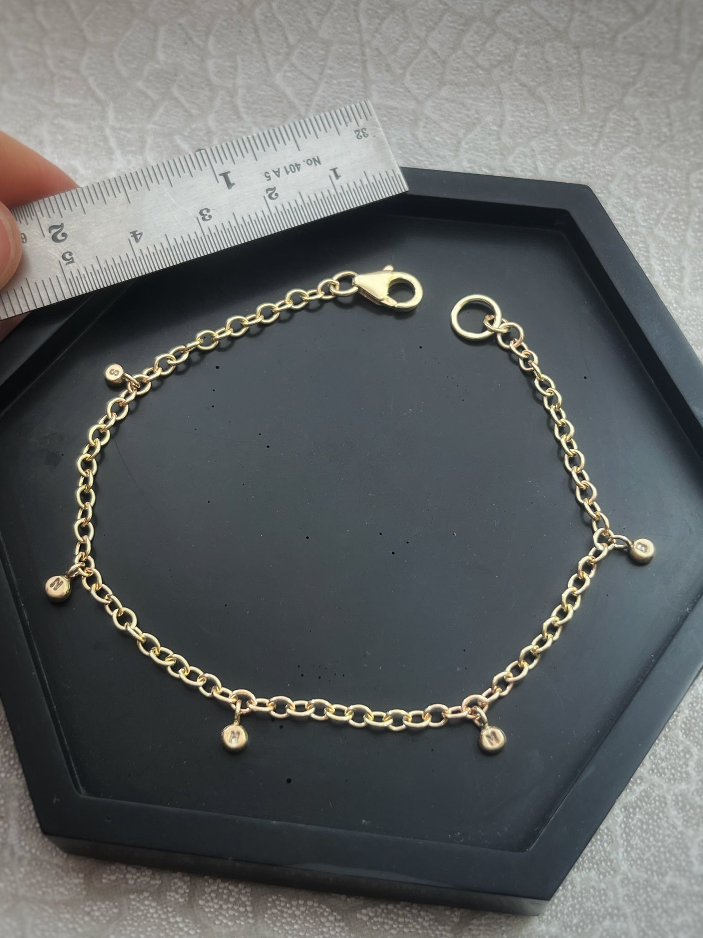 Solid 9ct gold personalised 5 letter pebble charm bracelet, recycled initial handmade chain bracelet