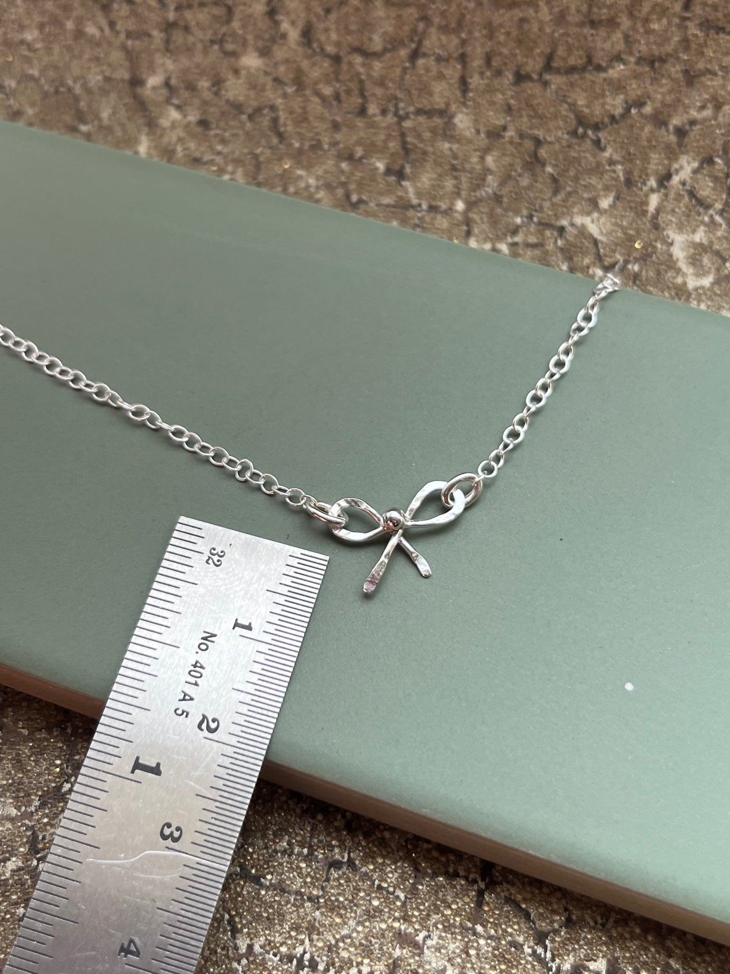 Hammered Bow little sterling silver necklace