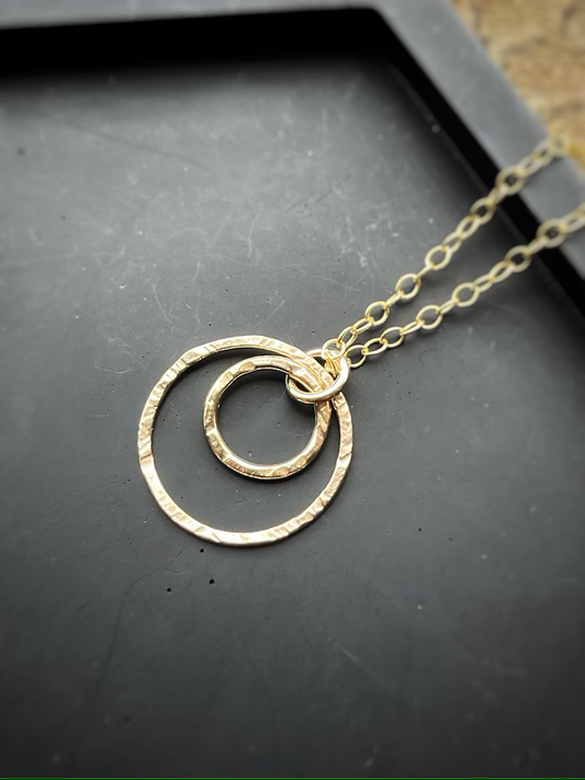 Solid 9ct gold interlocking circle pendant, a handmade hammered textured necklace