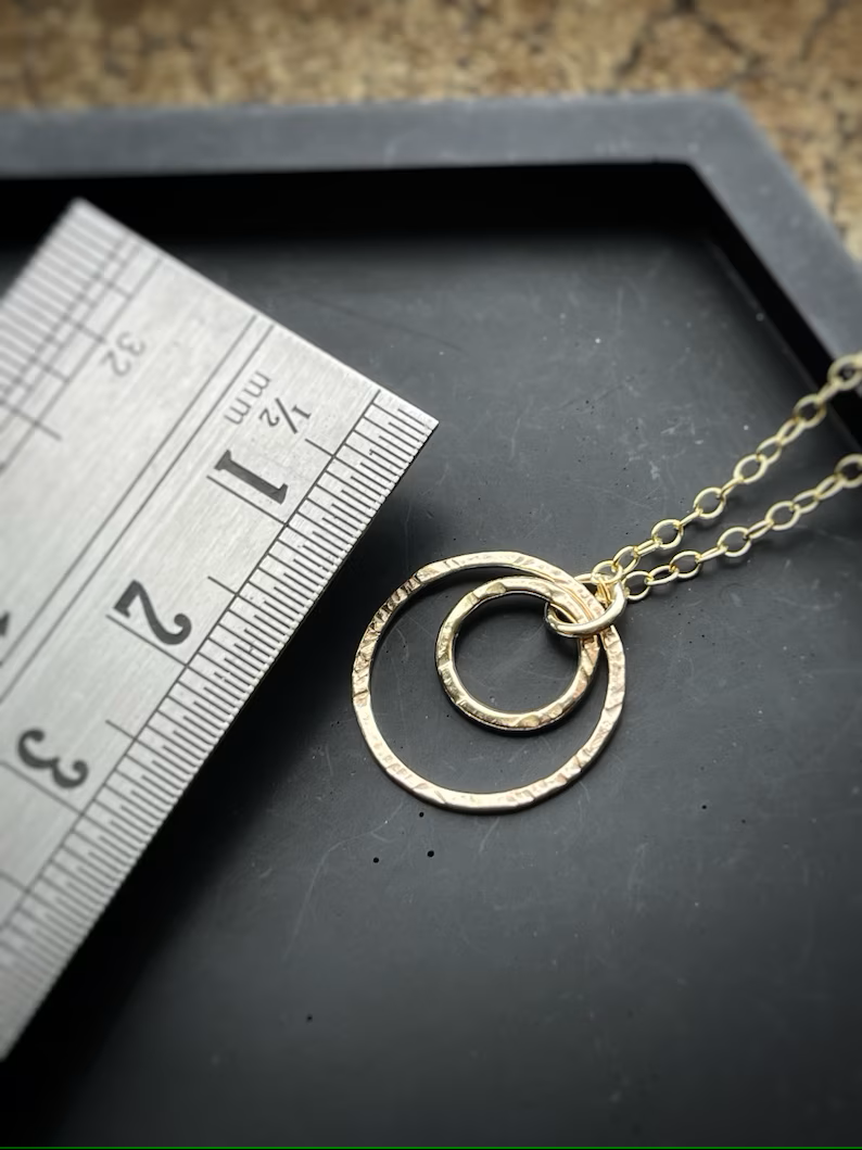 Solid 9ct gold interlocking circle pendant, a handmade hammered textured necklace