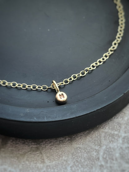 Solid 9ct gold tiny letter pebble bracelet, recycled personalised initial stacking handmade