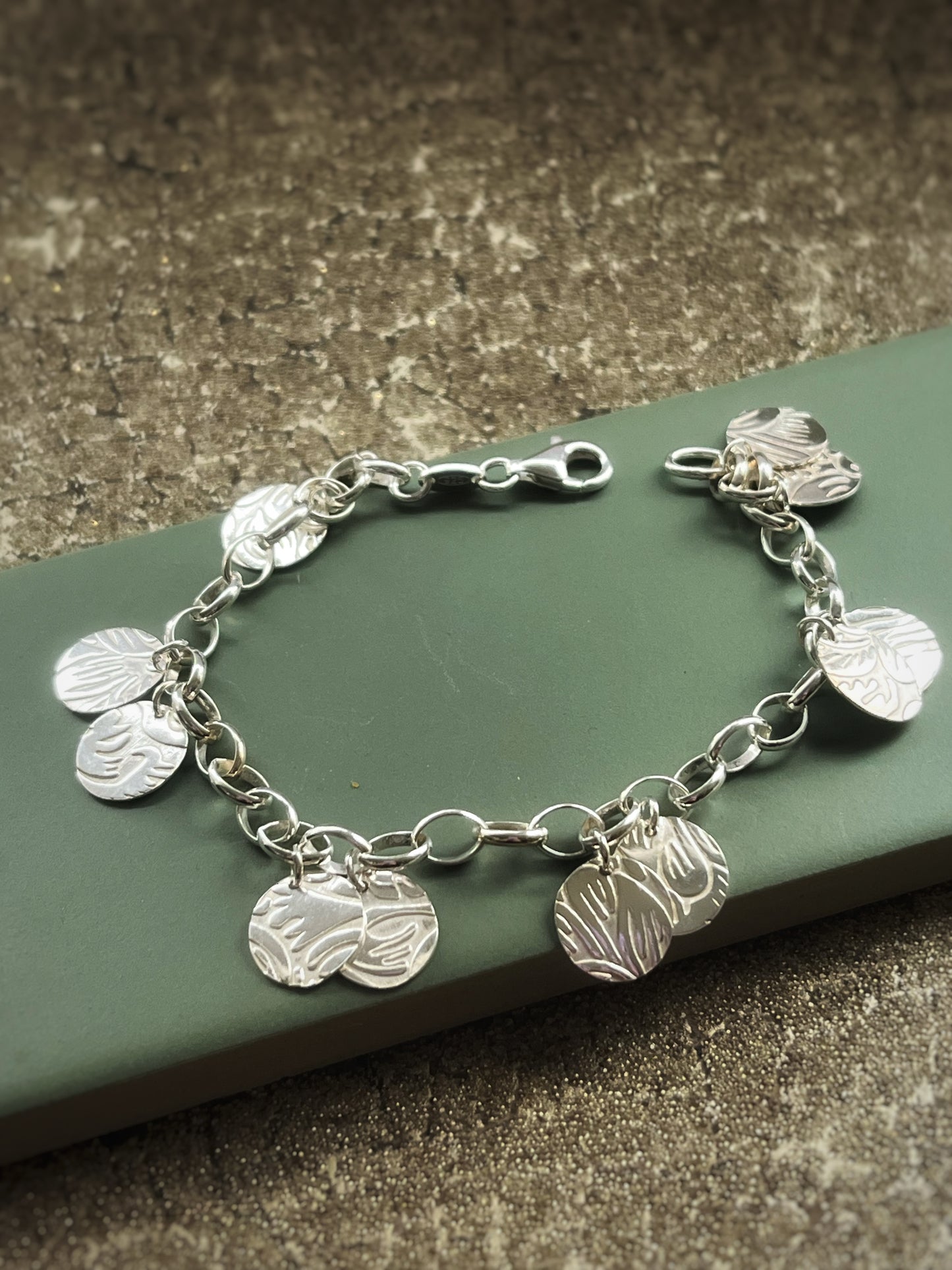 Floral embossed sterling silver charm bracelet