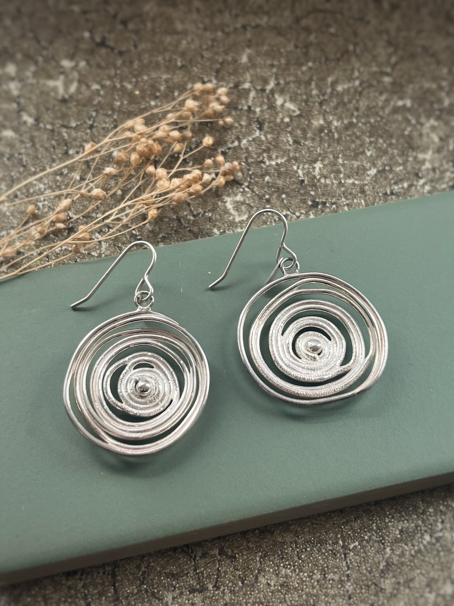 Sterling silver swirl statement earrings