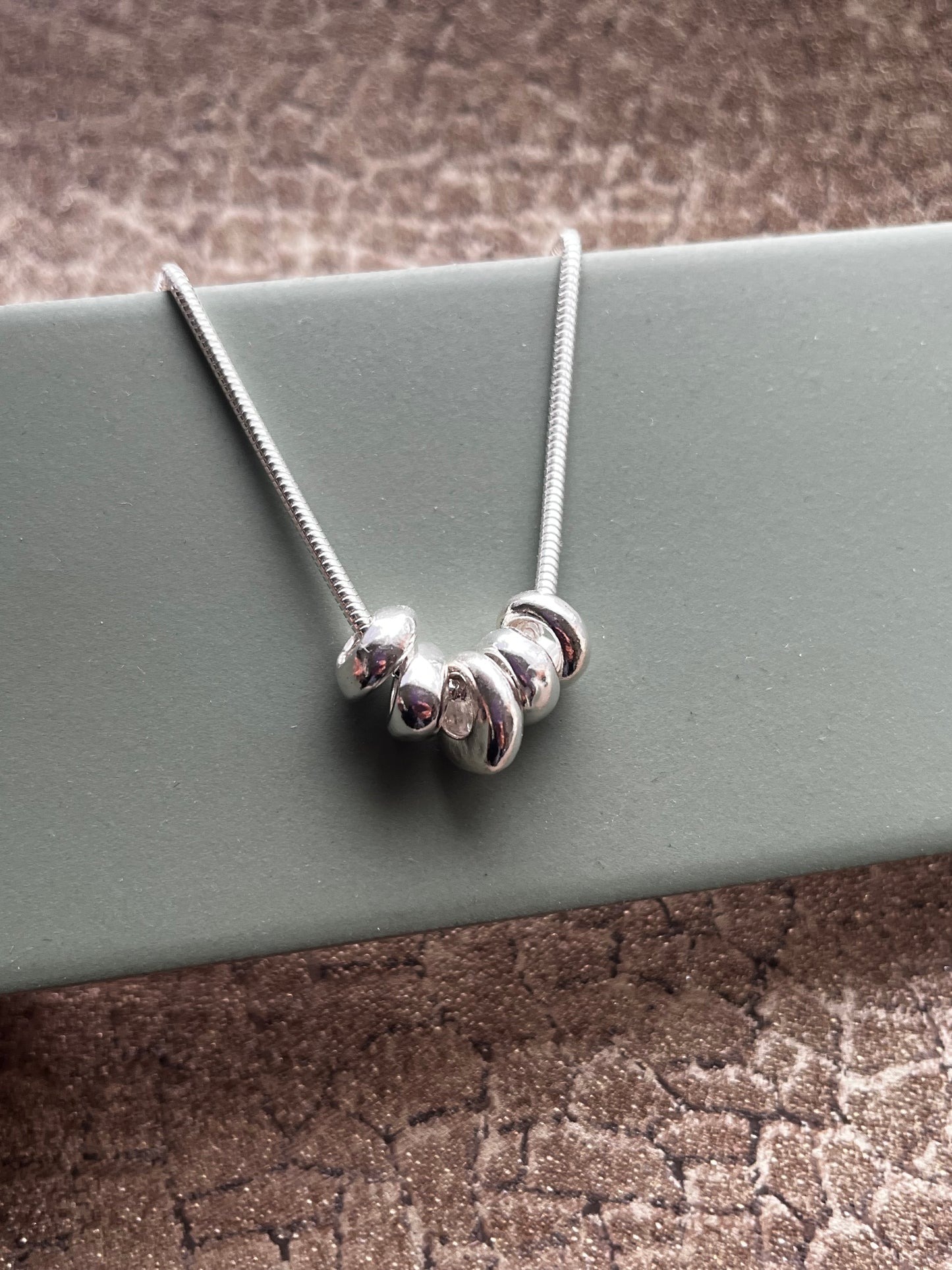 Sterling silver 5 pebble pendant necklace