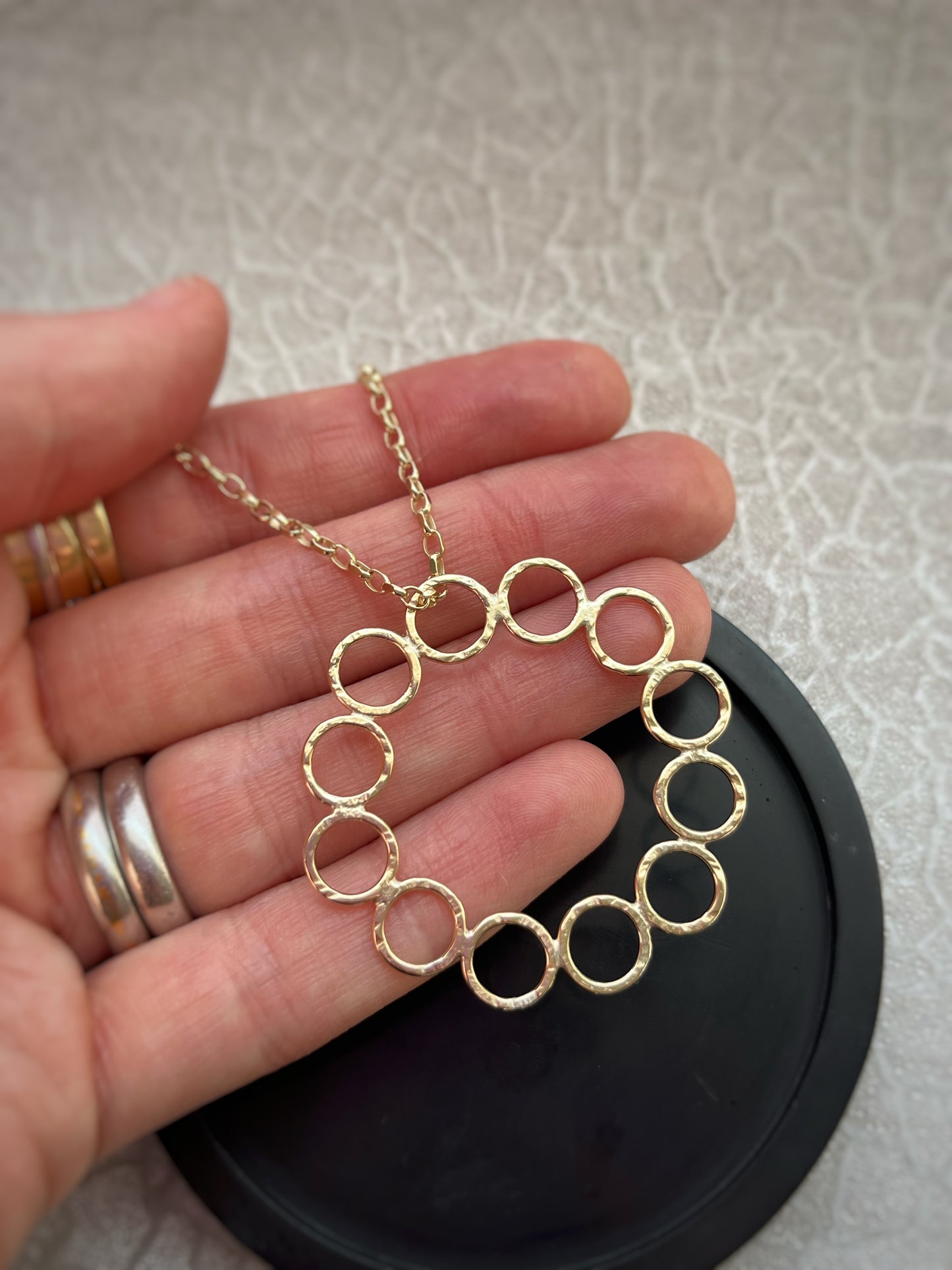 Solid 9ct gold 12 hoop statement circle pendant, a handmade hammered textured necklace