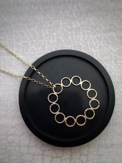 Solid 9ct gold 12 hoop statement circle pendant, a handmade hammered textured necklace