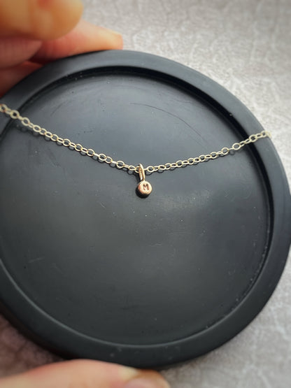 Solid 9ct gold tiny letter pebble bracelet, recycled personalised initial stacking handmade