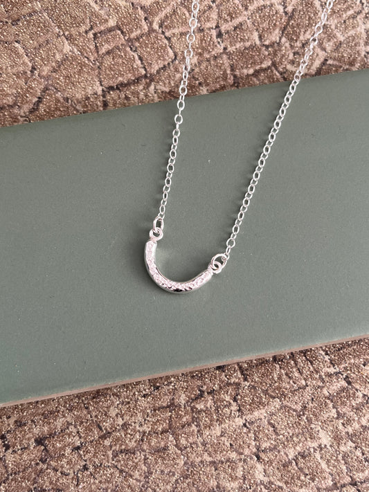 Sterling silver dimple textured curved chunky bar necklace