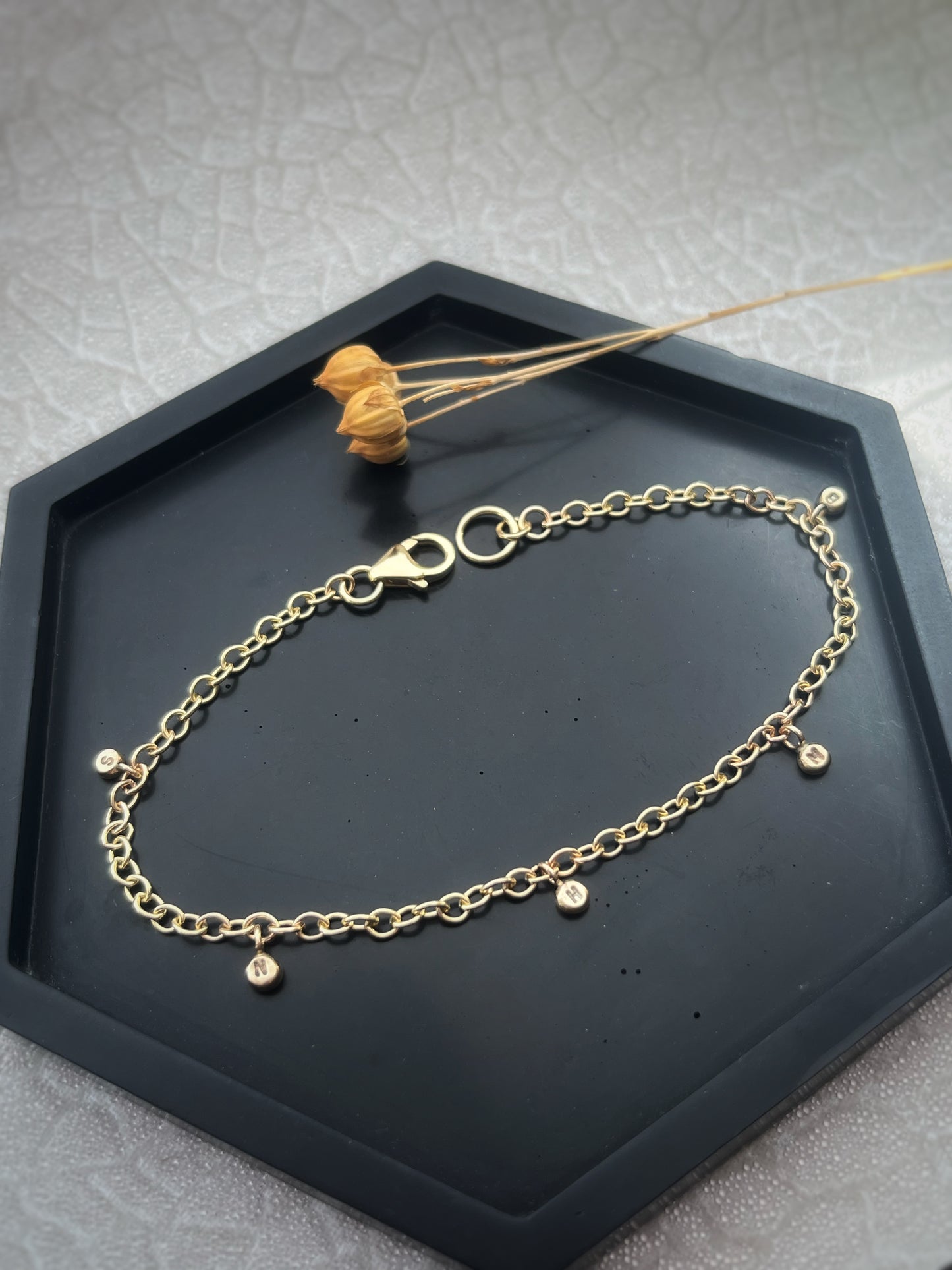 Solid 9ct gold personalised 5 letter pebble charm bracelet, recycled initial handmade chain bracelet
