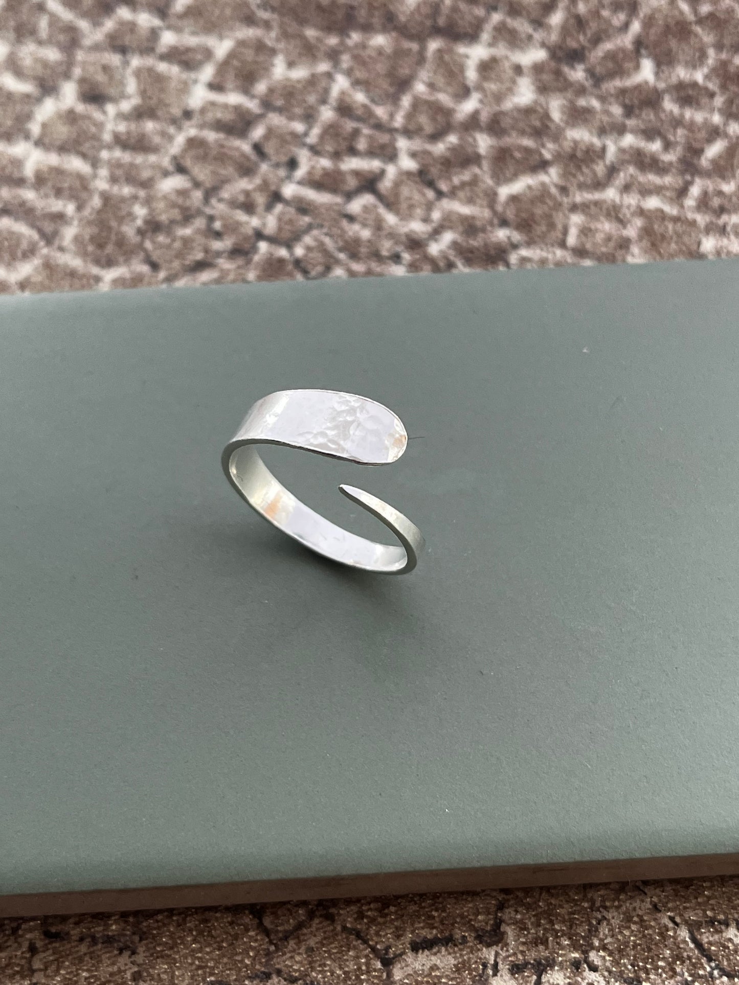 Textured cross over sterling silver ring size O adjustable