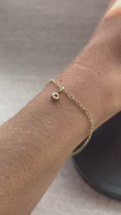Solid 9ct gold tiny letter pebble bracelet, recycled personalised initial stacking handmade