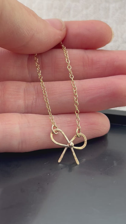 Solid 9ct solid gold bow necklace, a handmade hammered textured ribbon style bow